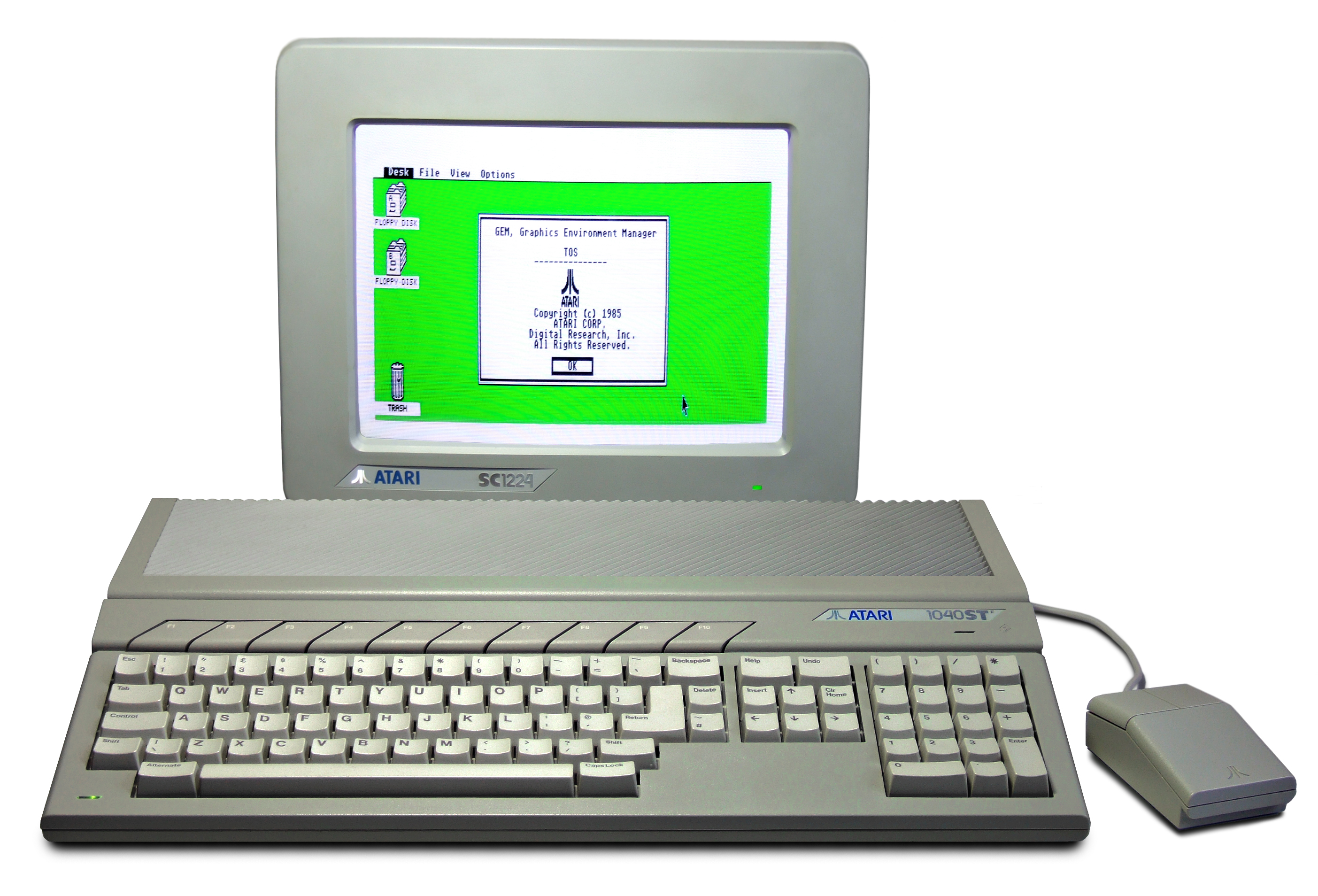 An Atari 1040STF computer with keyboard, mouse, and Atari SC1224 color monitor, the GEM desktop visible on screen